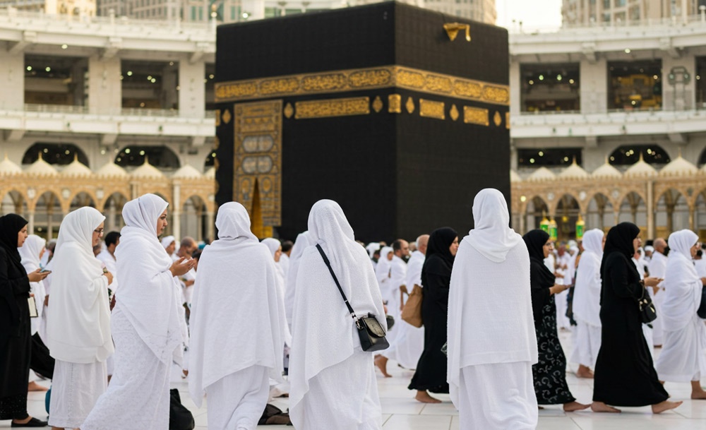 Women pilgrims walking towards Masjid al-Haram beneath the Makkah Clock Tower